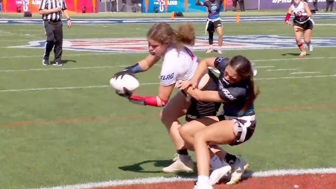 Girls flag football players competing for the ball